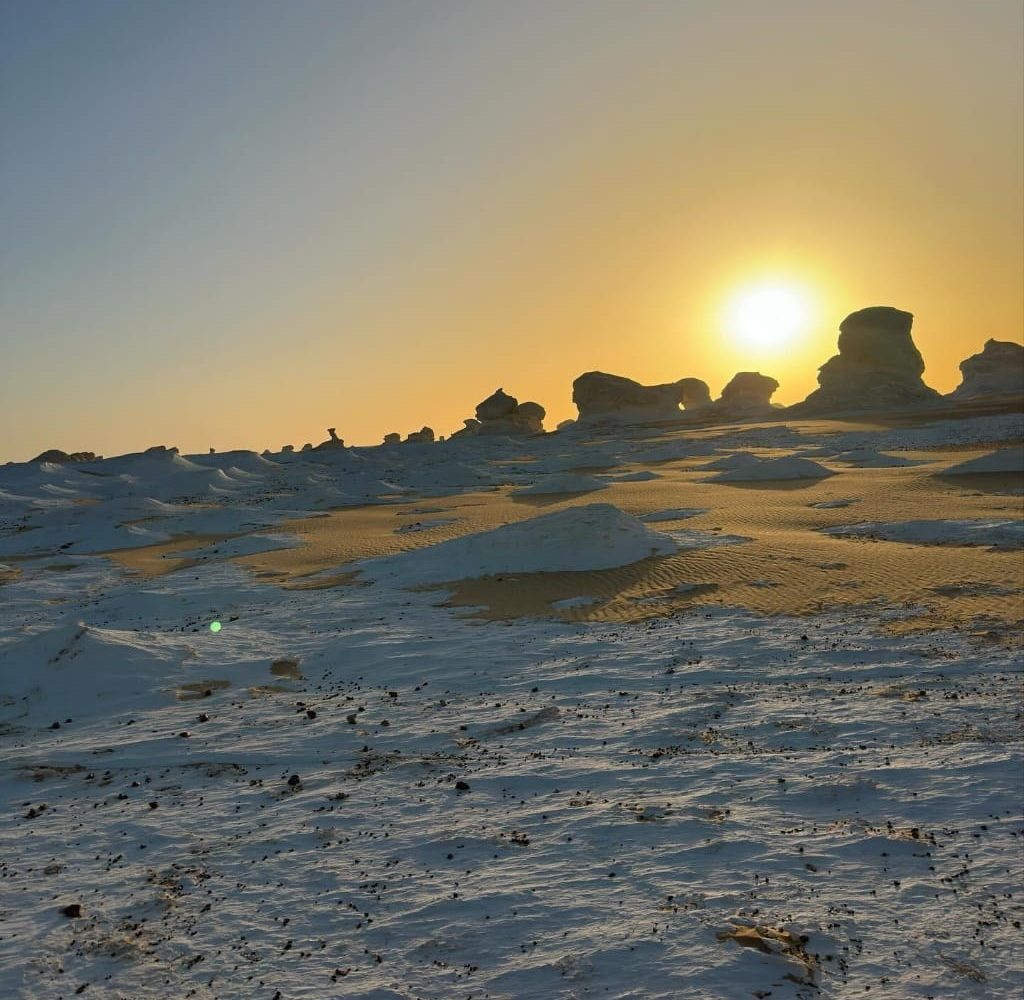 A view of the stark white geological formations of the White Desert