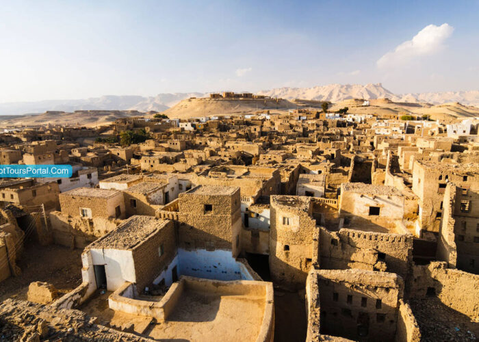 The intricate, ancient mud-brick architecture of Al-Qasr village in Dakhla Oasis, displaying historical charm and narrow alleyways