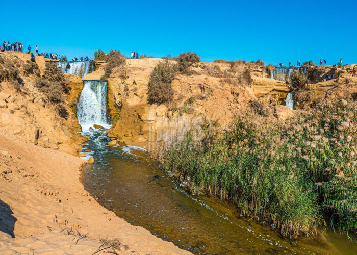 The impressive waterfalls of Wadi El Rayan connecting its two artificial lakes, surrounded by desert landscape in Fayoum